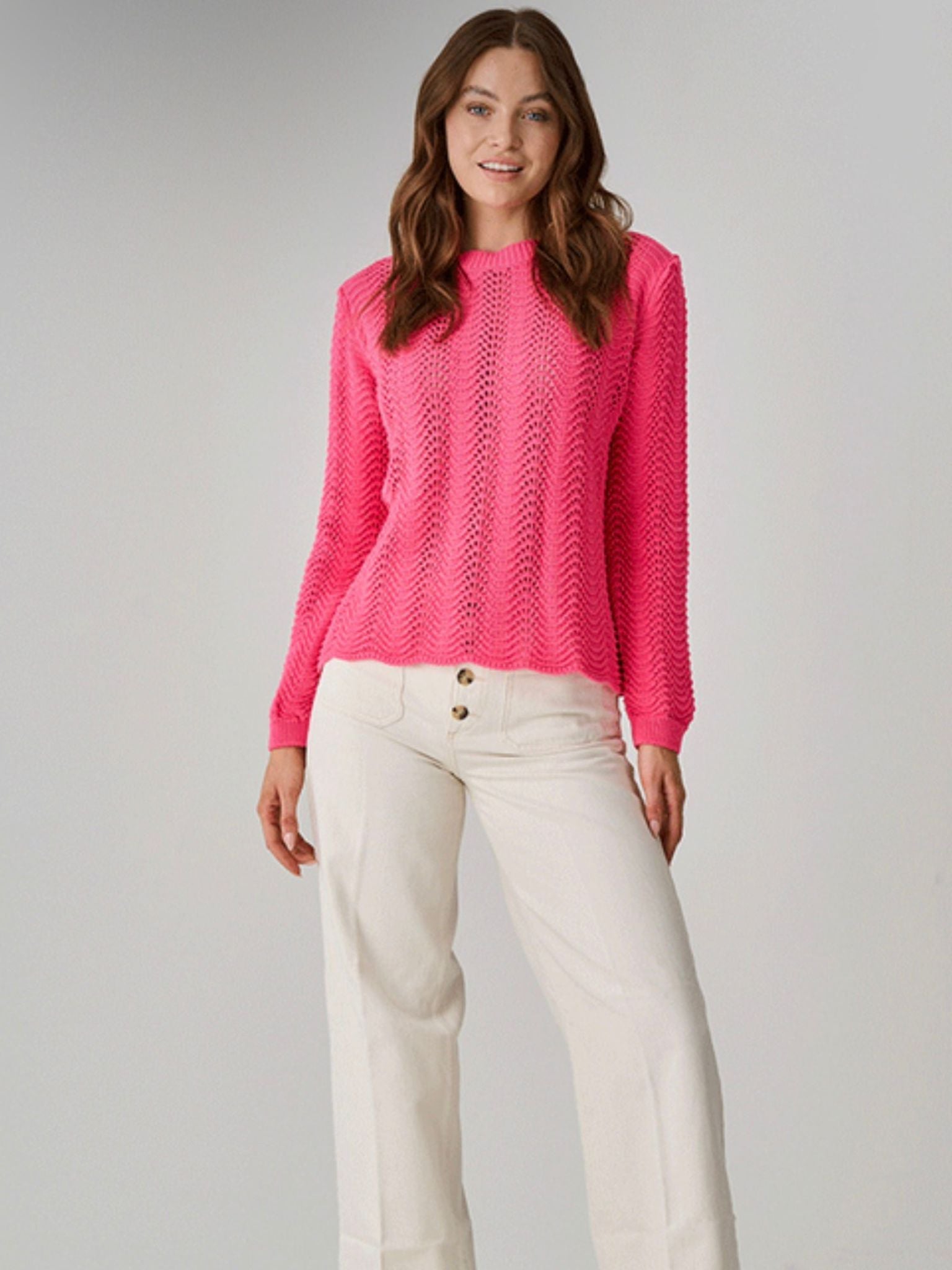Bibury Cotton Jumper Open Weave Pattern Pink paired with cream straight leg trousers