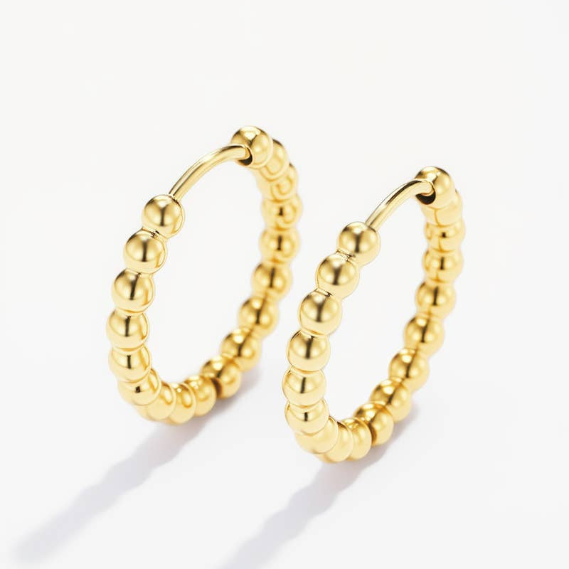 Gold hoop earrings with beaded design 